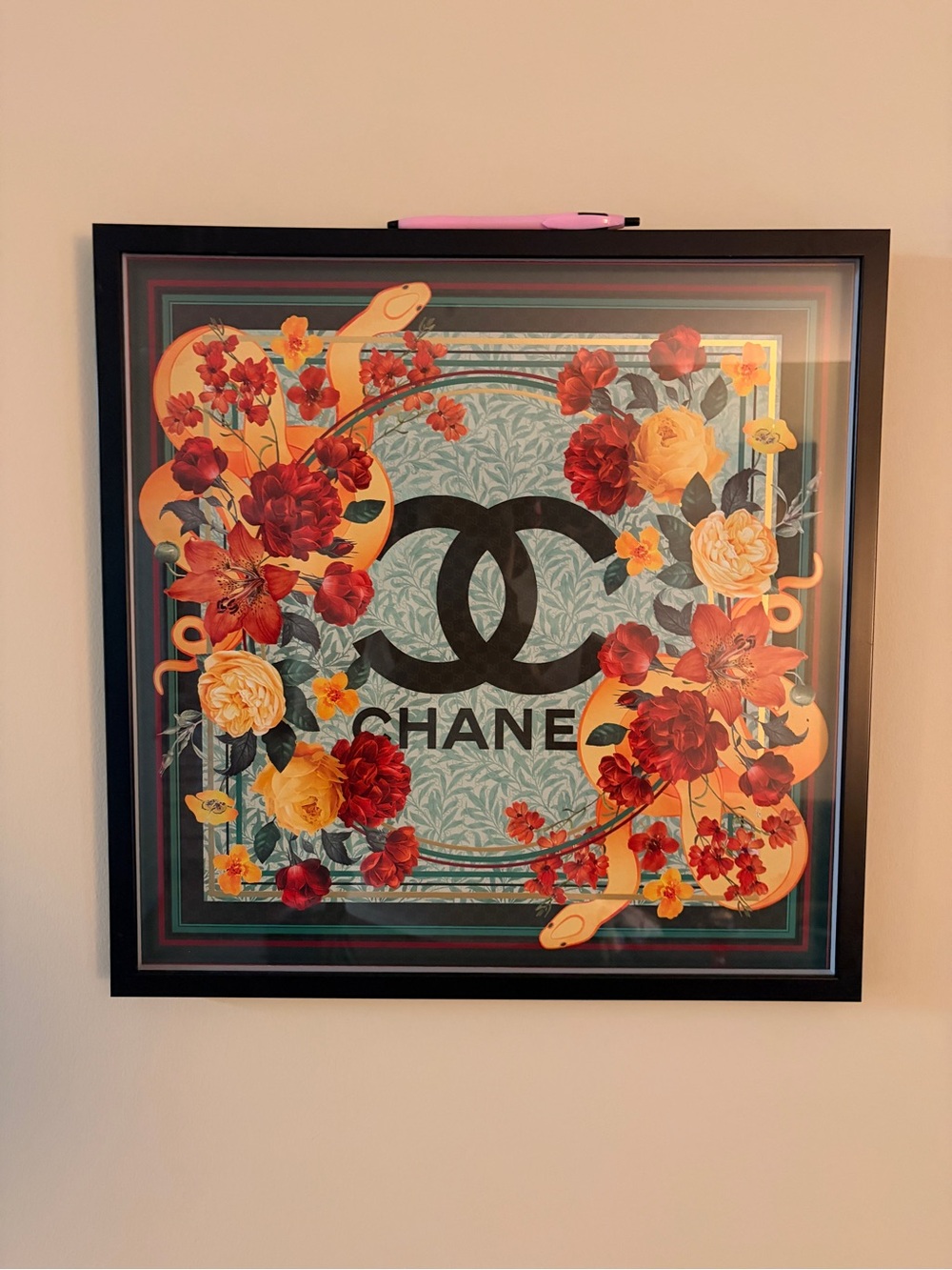 CHANEL Black Logo Floral Wall Art with Red and Yellow Blooms